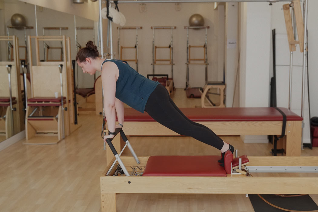 Claire Schapira on the reformer in the Palma Pilates Studio