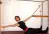 Pilates Push Through with Twist on the Cadillac
