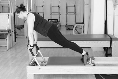 Claire Schapira on the reformer in the Palma Pilates Studio